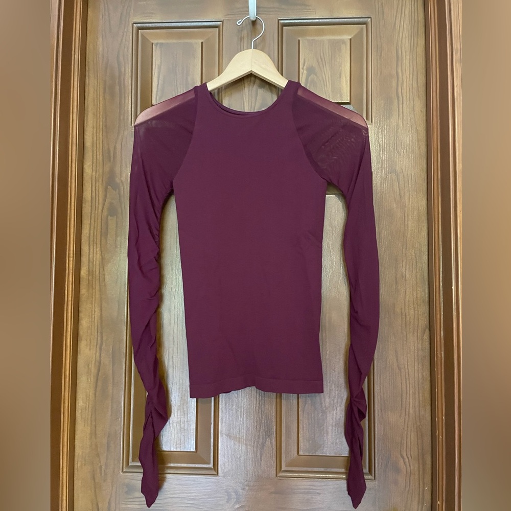 Free People intimately long sleeved top with sheer mesh sleeves
